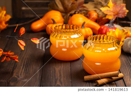 Autumn pumpkin drink with cinnamon and fall decor Autumn pumpkin drink with cinnamon and fall decor 141819613