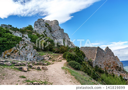 The Cathar medieval castle of Peyrepertuse in the Aude department, southern France situated in the French Pyrenees The Cathar medieval castle of Peyrepertuse in the Aude department, southern France situated in the French Pyrenees 141819899