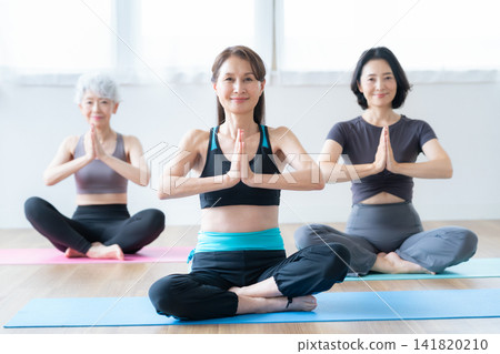 A senior woman who does yoga and her friend A senior woman who does yoga and her friend 141820210