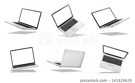 Falling or levitate laptop computers with blank screen isolated on white background with shadow Falling or levitate laptop computers with blank screen isolated on white background with shadow 141820620