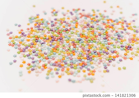 Colored sugar stars sprinkles background Colored sugar stars sprinkles background 141821306