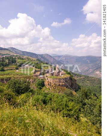 View of historic Armenian Tatev monastery on mountain ridge View of historic Armenian Tatev monastery on mountain ridge 141821405
