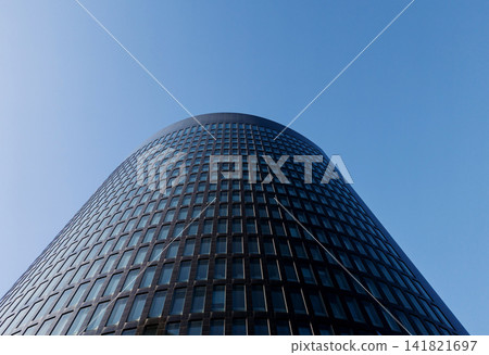 Low angle view of modern glass skyscraper corporate building. 141821697