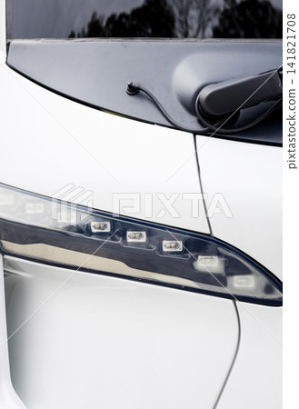 Minimalist electric bus exterior detail with LED light and wiper. Minimalist electric bus exterior detail with LED light and wiper. 141821708