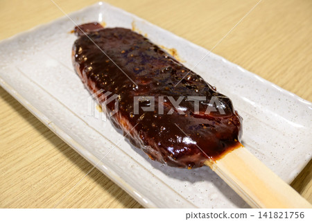 Goheimochi, a local dish from the Tokai region, is a traditional Japanese sweet with a fragrant miso sauce. Goheimochi, a local dish from the Tokai region, is a traditional Japanese sweet with a fragrant miso sauce. 141821756