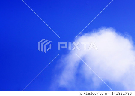 A copy space (background material) of a clear blue sky and white clouds. A copy space (background material) of a clear blue sky and white clouds. 141821786