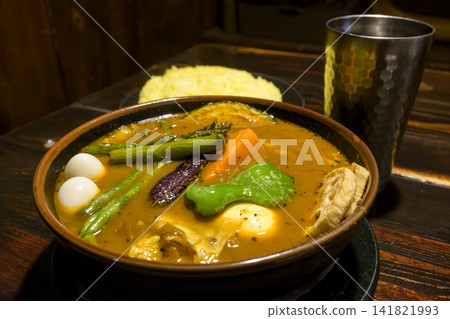 Hokkaido specialty: Colorful vegetable and chicken soup curry Hokkaido specialty: Colorful vegetable and chicken soup curry 141821993