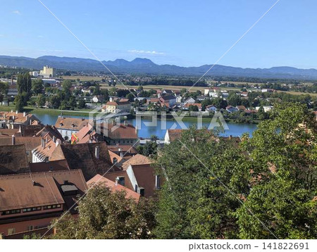 Panoramic view of old town red roofs and Drava river from Ptuj castle Slovenia Panoramic view of old town red roofs and Drava river from Ptuj castle Slovenia 141822691