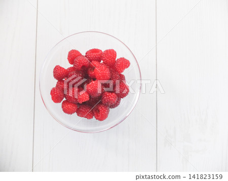 Berries served on a white glass plate Berries served on a white glass plate 141823159