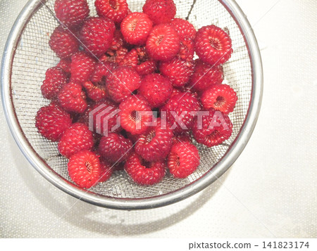 Berries on a sieve Berries on a sieve 141823174
