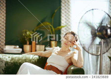 Woman Seeking Relief from Summer Heat Exhaustion Woman Seeking Relief from Summer Heat Exhaustion 141823689