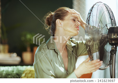 Overheated Woman Seeking Relief from Summer Heat Overheated Woman Seeking Relief from Summer Heat 141823697
