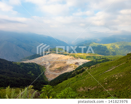 Panoramic view of mountains with a large open pit mine Panoramic view of mountains with a large open pit mine 141823976