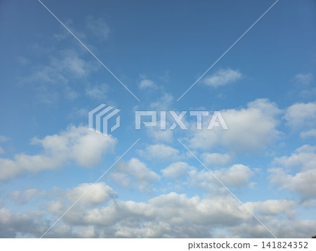 Bright blue sky with soft white clouds suitable for backgrounds and templates Bright blue sky with soft white clouds suitable for backgrounds and templates 141824352