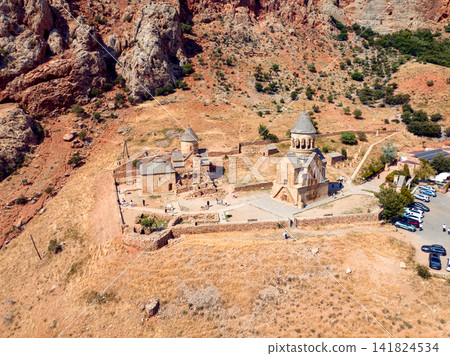 High-angle photograph showing historic Noravank monastery in arid, mountainous region High-angle photograph showing historic Noravank monastery in arid, mountainous region 141824534