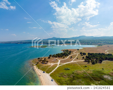 Aerial view of a coastal landscape with turquoise waters Aerial view of a coastal landscape with turquoise waters 141824581
