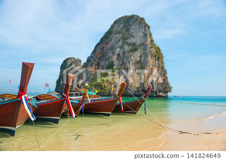 Row of boats at tropical beach Row of boats at tropical beach 141824649