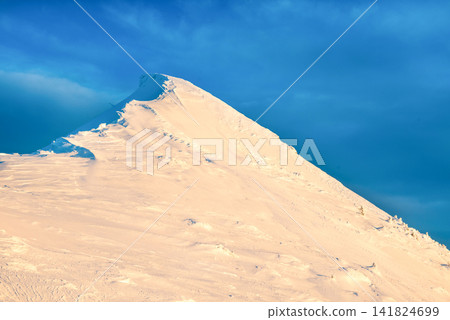 Mountain peak in snow 141824699