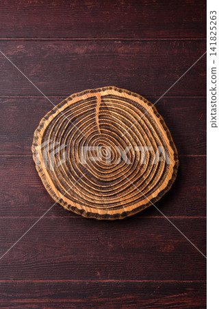 A square wooden cutting board for home food preparation. A wooden cutting board A square wooden cutting board for home food preparation. A wooden cutting board 141825263