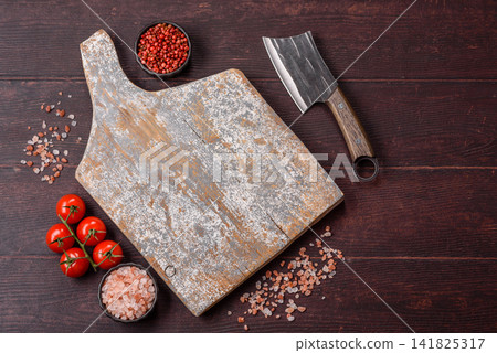 A square wooden cutting board for home food preparation. A wooden cutting board A square wooden cutting board for home food preparation. A wooden cutting board 141825317