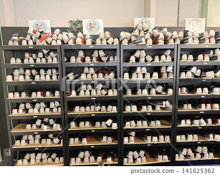Organized bowling shoes on storage shelves Organized bowling shoes on storage shelves 141825362