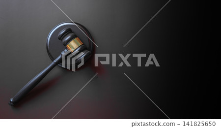 Wooden judge gavel with sound block on dark black background, court justice and legal system concept Wooden judge gavel with sound block on dark black background, court justice and legal system concept 141825650