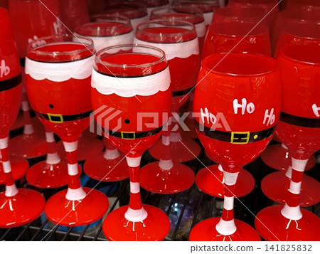 Festive Santa Claus-style wine glasses for the New Year Festive Santa Claus-style wine glasses for the New Year 141825832