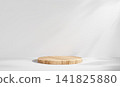 White interior studio scene with wooden podium. Natural wood platform on light surface for product presentation. Minimal clean exhibition backdrop. 141825880