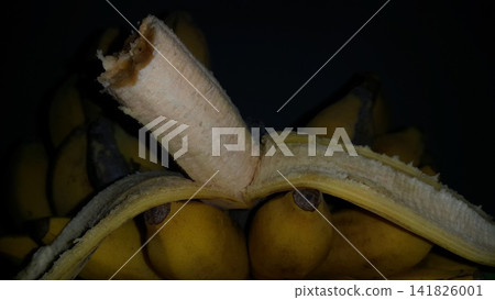 Shot of the contents of a partially eaten banana. Bananas are still fresh and very delicious. Shot of the contents of a partially eaten banana. Bananas are still fresh and very delicious. 141826001