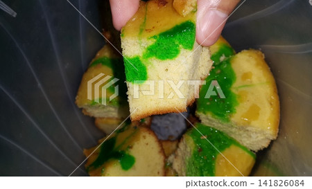 Shot of the texture of a green sponge cake that has been cut. Shot of the texture of a green sponge cake that has been cut. 141826084