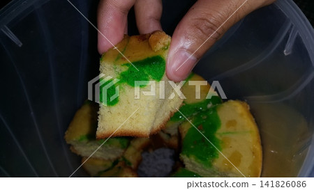Shot of the texture of a green sponge cake that has been cut. Shot of the texture of a green sponge cake that has been cut. 141826086