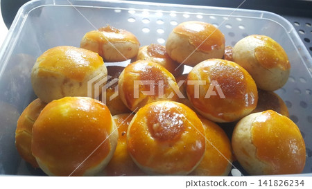 Nastar cake is a round pastry made from a mixture of wheat flour, butter, eggs and sugar, filled with pineapple jam. Nastar cake is a round pastry made from a mixture of wheat flour, butter, eggs and sugar, filled with pineapple jam. 141826234