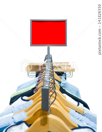 Empty red rectangular promotional display sign mockup over a clothing rack in a shop Empty red rectangular promotional display sign mockup over a clothing rack in a shop 141826350
