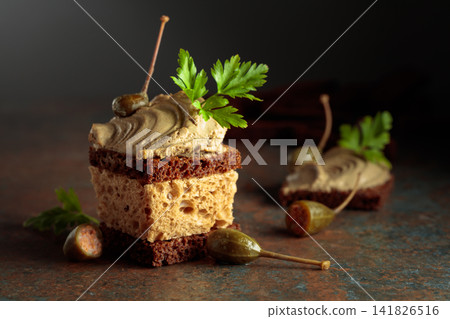 Bread with pate, capers, and fresh parsley. Bread with pate, capers, and fresh parsley. 141826516