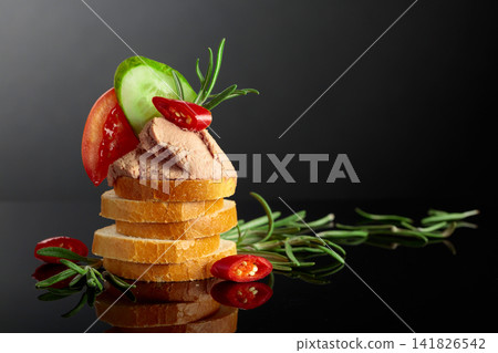 Bread slices with pate, tomato, cucumber, red pepper, and rosemary. Bread slices with pate, tomato, cucumber, red pepper, and rosemary. 141826542