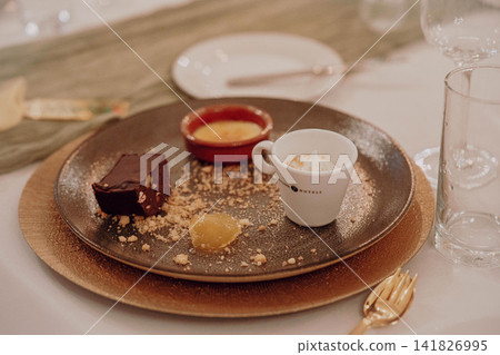 Gourmet dining experience with exquisite dish presentation. Fine wedding dining and culinary art. Gourmet dining experience with exquisite dish presentation. Fine wedding dining and culinary art. 141826995