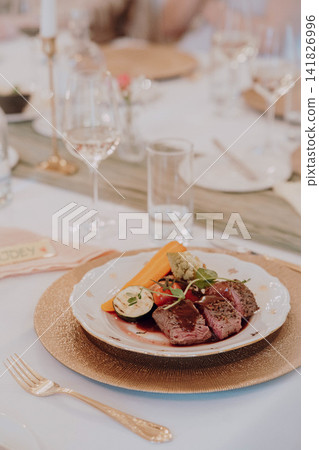 Gourmet dining experience with exquisite dish presentation. Fine wedding dining and culinary art. Gourmet dining experience with exquisite dish presentation. Fine wedding dining and culinary art. 141826996