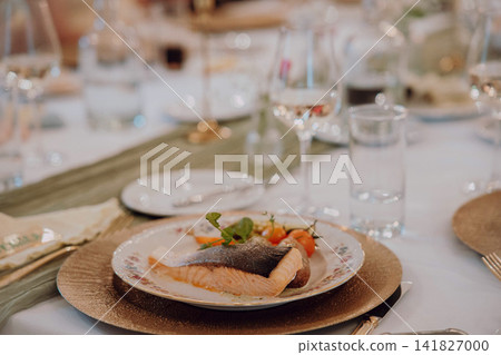 Gourmet dining experience with exquisite dish presentation. Fine wedding dining and culinary art. Gourmet dining experience with exquisite dish presentation. Fine wedding dining and culinary art. 141827000