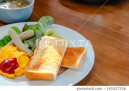 An overhead view of a Western-style breakfast plate served at a hotel breakfast buffet. A healthy start to the day. An overhead view of a Western-style breakfast plate served at a hotel breakfast buffet. A healthy start to the day. 141827316