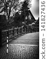 Wooden Bridge Near Residential House in Black and White 141827436