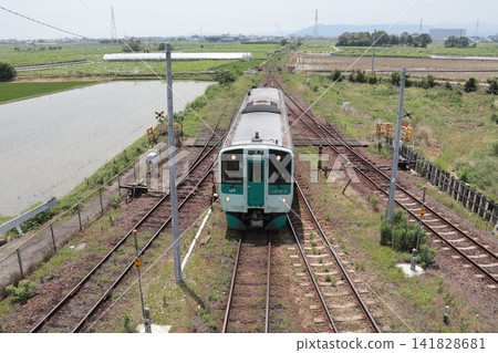A Naruto Line train running near JR Ikenotani Station. A Naruto Line train running near JR Ikenotani Station. 141828681
