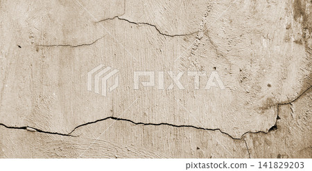 Cracked beige concrete wall texture Cracked beige concrete wall texture 141829203