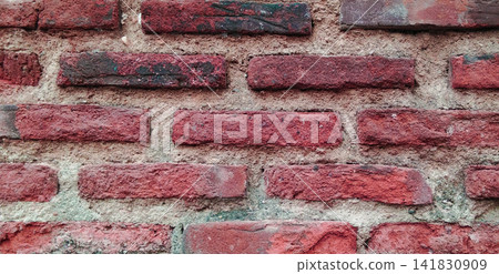Weathered red brick wall with sandy mortar joints Weathered red brick wall with sandy mortar joints 141830909