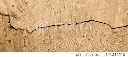 Cracked beige concrete wall texture 141830910