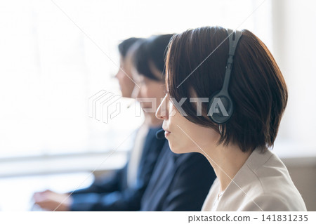 Female operator talking on intercom 141831235