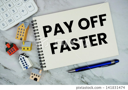 Pay Off Faster text written on notepad with house model and calculator on marble background Pay Off Faster text written on notepad with house model and calculator on marble background 141831474