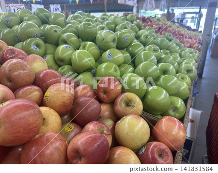 Red and green apples piled high in an American market Red and green apples piled high in an American market 141831584