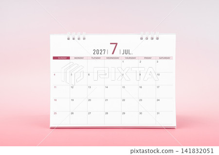 July blank desk calendar for 2027 year on pink color background. July blank desk calendar for 2027 year on pink color background. 141832051