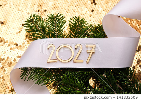 Golden New Year's background with the number of the coming year 2027. Golden New Year's background with the number of the coming year 2027. 141832509
