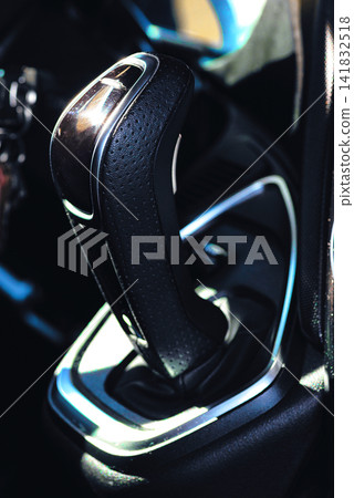 Close up of a modern automatic car gear shift selector console Close up of a modern automatic car gear shift selector console 141832518